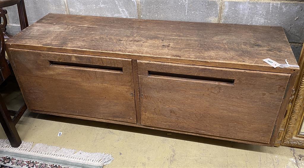 A Betty Joel style oak two door low cabinet, length 137cm, depth 44cm, height 55cm